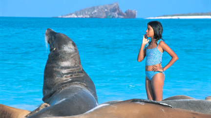 Ecuador and Gálapagos travel information - Galapagos Ecuador Girl and sea lion